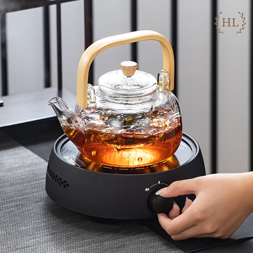 Ấm Thủy Tinh Chịu Nhiệt Đun Trực Tiếp Trên Bếp Gas Bếp Hồng Ngoại 900ml ẤM THỦY TINH CHỊU NHIỆT TAY CẦM GỖ CAO CẤP
